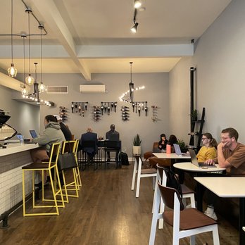 Squibb Coffee and Wine Bar - people sitting at tables - Coffee & Tea Near Me - Grand Rapids, Michigan Squibb Coffee and Wine Bar - people sitting at tables - Coffee & Tea Near Me - Grand Rapids, Michigan