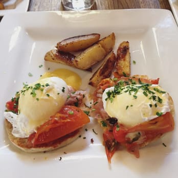 Brasil - Eggs Benedict with 4 potato wedges at Brasil - Breakfast & Brunch Near Me - Houston, Texas