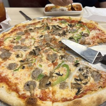 Tito's Restaurant Pizzeria - Sausage, pepper, onion, and mushroom pizza - Pizza Near Me - Greenville, South Carolina Tito's Restaurant Pizzeria - Sausage, pepper, onion, and mushroom pizza - Pizza Near Me - Greenville, South Carolina