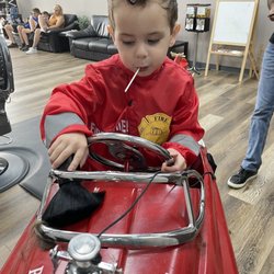 Twenty 21 Barbershop - Getting his haircut and helping clean up!