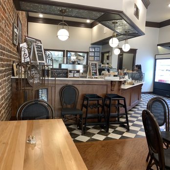 Stone House Kitchen - a brick wall with a checkered floor - New American Near Me - Nacogdoches, Texas Stone House Kitchen - a brick wall with a checkered floor - New American Near Me - Nacogdoches, Texas