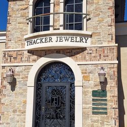 Thacker Jewelry - Building front with hours.