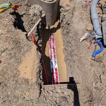 TrenchFree - Caution tape after backfilling with sand - Plumbing Near Me - San Jose, California TrenchFree - Caution tape after backfilling with sand - Plumbing Near Me - San Jose, California