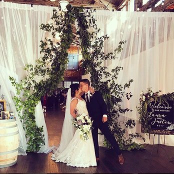 Analog Floral - Entrance to the ceremony - the garland blew us away! - Florists Near Me - Seattle, Washington