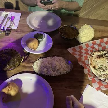 Whip In - Apologies for the lighting. Starter and naan to share, plus two entrees. Four satisfying meals out of this spread. 03AUG26 - Beer, Wine & Spirits Near Me - Austin, Texas Whip In - Apologies for the lighting. Starter and naan to share, plus two entrees. Four satisfying meals out of this spread. 03AUG26 - Beer, Wine & Spirits Near Me - Austin, Texas