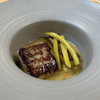Mägo - Roast Sea Bass, Pole Beans, Saffron and Squash - Colombian Near Me - Oakland, California Mägo - Roast Sea Bass, Pole Beans, Saffron and Squash - Colombian Near Me - Oakland, California