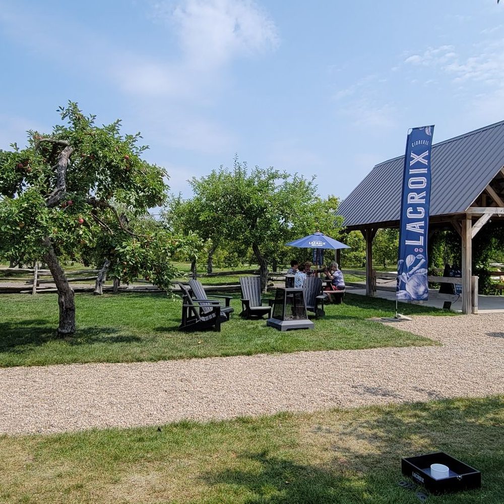 a picnic area with picnic tables and umbrellas a picnic area with picnic tables and umbrellas