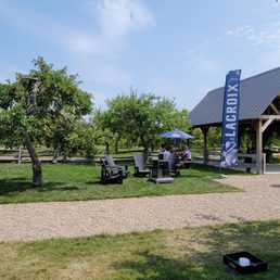 a picnic area with picnic tables and umbrellas