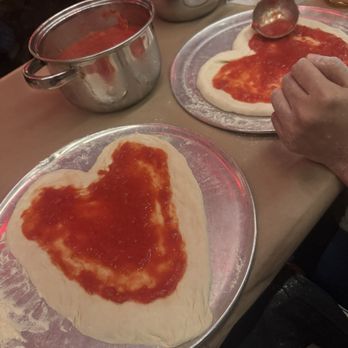 Adoro Lei - Adding in our sauce and toppings - Italian Near Me - New York, New York