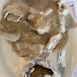 George's Kendig Square Restaurant - Sliced pork special over filling with gravy, and a baked potato on the side