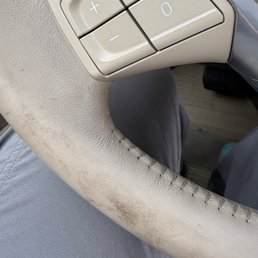 Grease/Oil over the steering wheel and console, gear shift were black smear grease, oil fingerprint marks all over the inside of the car.
