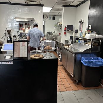 Enigma Coffee - a man working in a coffee shop - Coffee & Tea Near Me - Sherman Oaks, California Enigma Coffee - a man working in a coffee shop - Coffee & Tea Near Me - Sherman Oaks, California