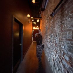 Walking down the long hallway.