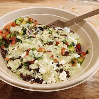 CAVA - Bowl with rice, lentils, steak, feta, tomatoes and cucumbers, and other assorted toppings. - Mediterranean Near Me - Sherman Oaks, California CAVA - Bowl with rice, lentils, steak, feta, tomatoes and cucumbers, and other assorted toppings. - Mediterranean Near Me - Sherman Oaks, California