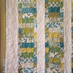 The Thread Peddler - Saw this on the wall and bought the jelly roll to make it. It's such a fun quilt :)