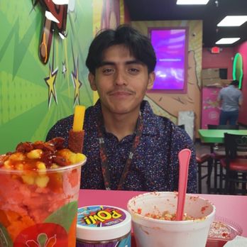 La Michoacana Plus - Left is the sandia mangonada, middle are their skittles coated with chili, and on the right is their hot cheeto corn in a cup - Ice Cream & Frozen Yogurt Near Me - San Jose, California La Michoacana Plus - Left is the sandia mangonada, middle are their skittles coated with chili, and on the right is their hot cheeto corn in a cup - Ice Cream & Frozen Yogurt Near Me - San Jose, California