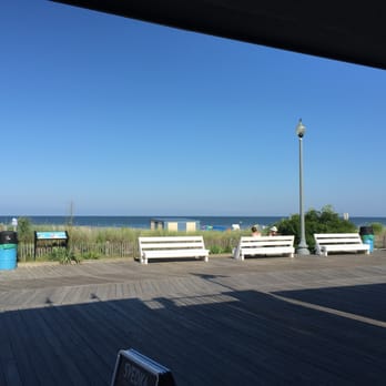 Whiskey Jack's - a man standing on a boardwalk overlooking the ocean - Bars Near Me - Rehoboth Beach, Delaware Whiskey Jack's - a man standing on a boardwalk overlooking the ocean - Bars Near Me - Rehoboth Beach, Delaware
