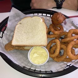 TC Mae's Family Diner - Catfish sandwich with homemade tartar sauce, hush puppy, and onion rings