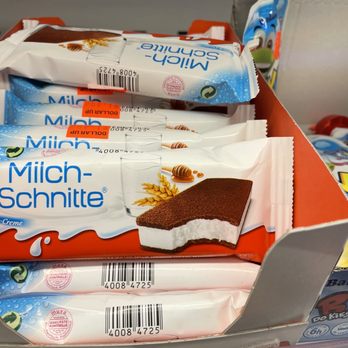 Dollar Up - a display of milk bars in a grocery store - International Grocery Near Me - Brooklyn, New York