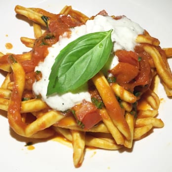 Felice 64 - Fusilli al Ferretto served with homemade tomato sauce and burrata cheese - Wine Bars Near Me - New York, New York Felice 64 - Fusilli al Ferretto served with homemade tomato sauce and burrata cheese - Wine Bars Near Me - New York, New York