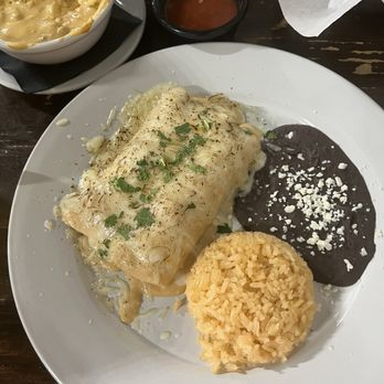 D Restaurant Latin Cuisine - Waxahachie - Chicken enchiladas with rice and refried black beans - Latin American Near Me - Waxahachie, Texas