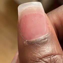 Q Spa & Nails - Nail with stuff sealed inside them.