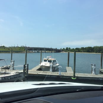 The Dock House - Sitting on the wharf eating fish and chips - Seafood Near Me - Sag Harbor, New York The Dock House - Sitting on the wharf eating fish and chips - Seafood Near Me - Sag Harbor, New York