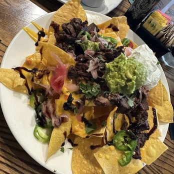 Local Goat - Steak Nachos* - New American Near Me - Pigeon Forge, Tennessee