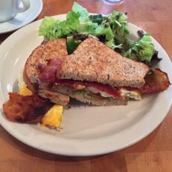 Commonwealth Cafe - Fried egg sandwich, guacamole, tomato, Pinconning cheddar, hot sauce, toasted multigrain, Suchman bacon, greens - Coffee & Tea Near Me - Birmingham, Michigan Commonwealth Cafe - Fried egg sandwich, guacamole, tomato, Pinconning cheddar, hot sauce, toasted multigrain, Suchman bacon, greens - Coffee & Tea Near Me - Birmingham, Michigan