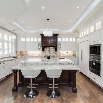 Kitchen and Bath - a large white kitchen with marble countertops - Kitchen & Bath Near Me - Oakville, Ontario