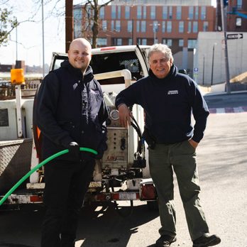 Snake It Away - The owner, Richie Sr, and his son, Richie Jr. with the water jetter that clears client's pipes and removes all roots. - Plumbing Near Me Snake It Away - The owner, Richie Sr, and his son, Richie Jr. with the water jetter that clears client's pipes and removes all roots. - Plumbing Near Me