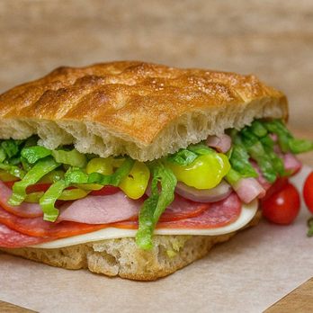 Point Eat - The Godmother sandwich packed with Italian meats, provolone cheese, fresh veggies, and our signature dressing on house-baked focaccia. - Sandwiches Near Me - Pasadena, California