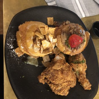 Taste Bar + Kitchen - Cinnamon Toast Crunch waffle, praline waffle, dark meat Cajun fried chicken - Cocktail Bars Near Me - Houston, Texas