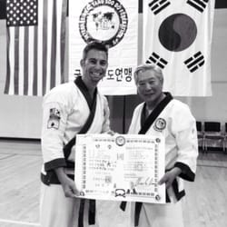 PTSDA Karate - Master Dufour being promoted to six degree black belt by his instructor, Grandmaster C S Kim.