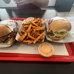 a tray of fries and a sandwich a tray of fries and a sandwich