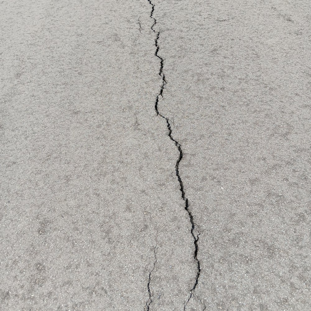 Capital Asphalt - large cracking up middle - Masonry/Concrete Near Me - Lansing, Michigan Capital Asphalt - large cracking up middle - Masonry/Concrete Near Me - Lansing, Michigan