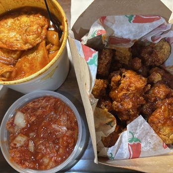 Mono Mono Korean Fried Chicken - Extra egg, onions and fish cake in tteokbokki. Crispy spicy fried chicken and a side of very delicious kimchi - Korean Near Me - Denver, Colorado