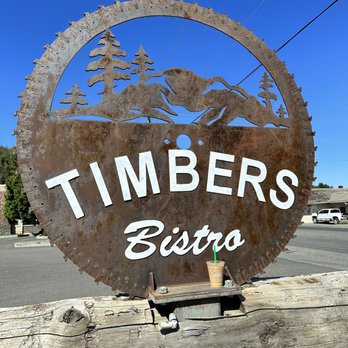 Timbers Bistro - a rusty sign on a wooden post - Breakfast & Brunch Near Me - John Day, Oregon