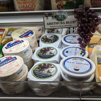 Sherman Iga - a variety of cheeses in a display case - Grocery Near Me Sherman Iga - a variety of cheeses in a display case - Grocery Near Me