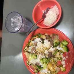 a plate of food and a glass of water