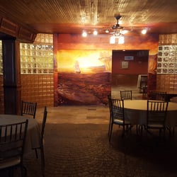 McCoole's Arts & Events Place - The main room with the bar and sliding mural door.
