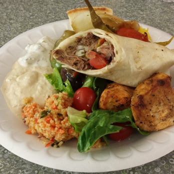 Cafe Izmir - A buffet on a plate. Lamb roll, cous cous, saffron rice, pita bread, roasted vegetables and peppers, and chicken kabob. - Middle Eastern Near Me - Dallas, Texas Cafe Izmir - A buffet on a plate. Lamb roll, cous cous, saffron rice, pita bread, roasted vegetables and peppers, and chicken kabob. - Middle Eastern Near Me - Dallas, Texas