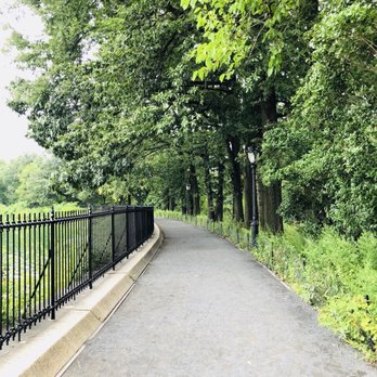 Central Park Conservancy - The path beside The Reservoir filled with lamp posts. - Parks Near Me - New York, New York Central Park Conservancy - The path beside The Reservoir filled with lamp posts. - Parks Near Me - New York, New York