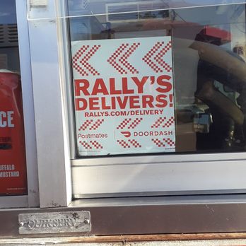 Rally's - a sign in the window of a restaurant - Burgers Near Me - Hawthorne, California