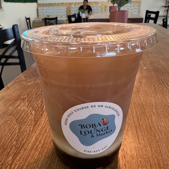 Boba Lounge & Market - a cup of coffee on a table - Bubble Tea Near Me - Albuquerque, New Mexico Boba Lounge & Market - a cup of coffee on a table - Bubble Tea Near Me - Albuquerque, New Mexico