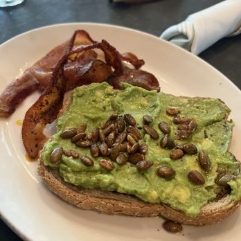 Caroline - avocado toast with a side of peppered bacon - Bakeries Near Me - Austin, Texas Caroline - avocado toast with a side of peppered bacon - Bakeries Near Me - Austin, Texas