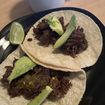 Pepe's Barbacoa No 4 - two beef tacos on a black plate - Barbeque Near Me - San Antonio, Texas Pepe's Barbacoa No 4 - two beef tacos on a black plate - Barbeque Near Me - San Antonio, Texas