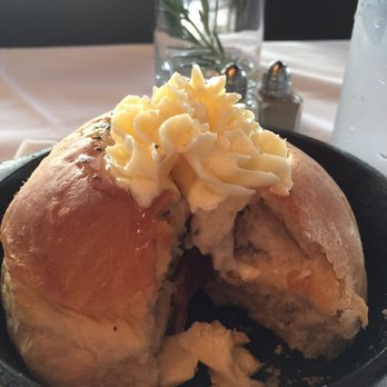 Cork & Cow - Warm bread topped with butter served in a mini cast iron pan - Steakhouses Near Me - Franklin, Tennessee Cork & Cow - Warm bread topped with butter served in a mini cast iron pan - Steakhouses Near Me - Franklin, Tennessee