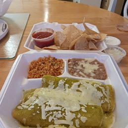 2 Chicken enchiladas with Verde sauce, refried beans, rice, chips and salsa 2 Chicken enchiladas with Verde sauce, refried beans, rice, chips and salsa
