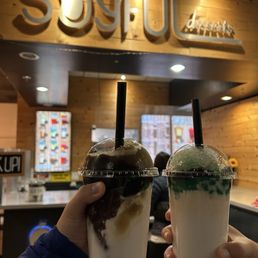 Exterior outside entrance of Soyful Desserts - Combination tofu pudding (left) and tofu pudding with pandan jelly and boba (right) - San Jose, California Exterior outside entrance of Soyful Desserts - Combination tofu pudding (left) and tofu pudding with pandan jelly and boba (right) - San Jose, California